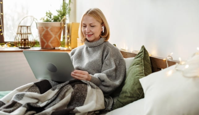Woman watching a video on her laptop